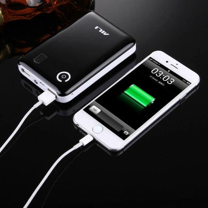 Compact Battery Case for Home and On-the-Go Needs shown charging a smartphone on a black surface, portable battery organizer for travel and home use