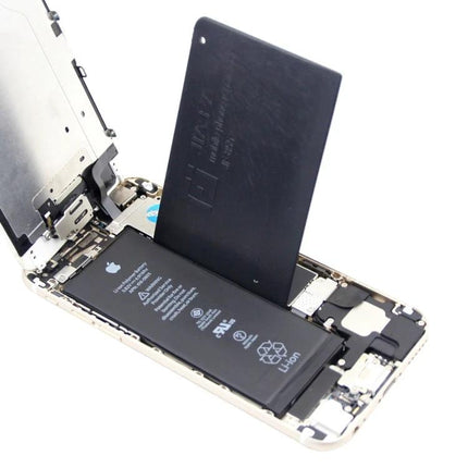 Crowbar Opening Prying Tool for Smartphone Battery Repairs being used to lift a smartphone battery during replacement