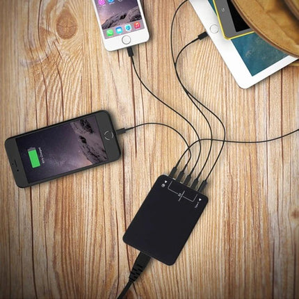 Multi-Port USB Charger for Everyday Home Device Use shown charging multiple phones and a tablet on a wooden table, reducing cable clutter