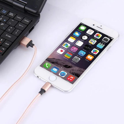 Essential Cable for Daily Device Charging on the Go – rose gold Lightning cable charging iPhone from laptop, reliable on-the-go power