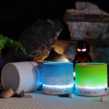 Compact Bedside Speaker With Ambient Night Light For Hands Free Calls on a bedside table with color-changing LED glow