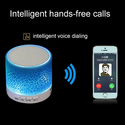 Compact Bedside Speaker With Ambient Night Light For Hands Free Calls showing blue LED speaker beside smartphone call screen
