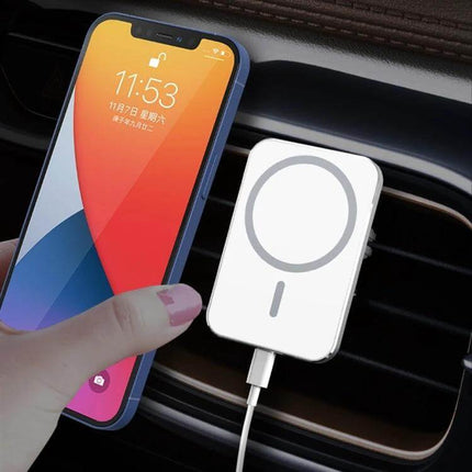 X16 Magnetic Car Vent Mount for Wireless Phone Charging attached to car vent with phone aligning to magnetic wireless charger
