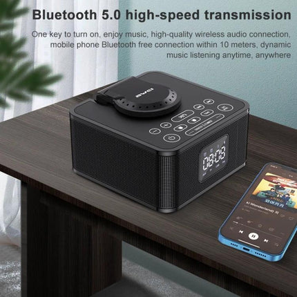 Awei Portable Bluetooth Speaker With Phone Stand For Home Travel on bedside table with phone showing music