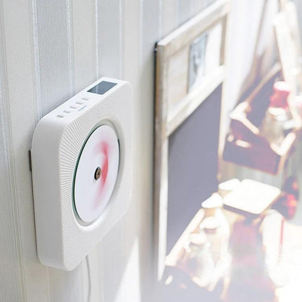 Portable Bluetooth Speaker for Playing CDs with Digital Display mounted on wall next to home decor, showing disc playback and digital screen