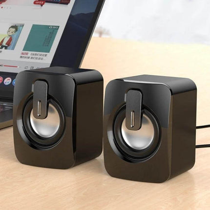 Compact Bluetooth USB Speaker For Desk Bedside Travel small black USB speakers next to laptop for music and calls
