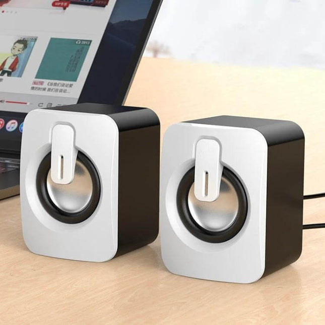Compact Bluetooth USB Speaker For Desk Bedside Travel compact mini USB speakers on desk next to laptop for music