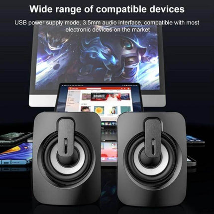 Compact Bluetooth USB Speaker For Desk Bedside Travel showing compact twin speakers in front of monitor and laptop setup