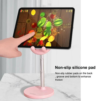 Foldable Adjustable Desktop Holder for Phones and Tablets in pink holding a tablet with non-slip silicone pad for hands-free viewing and ergonomic use