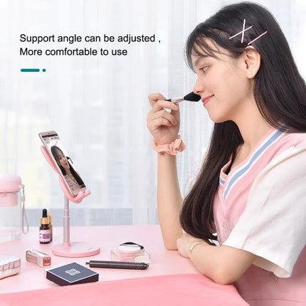 Foldable Adjustable Desktop Holder for Phones and Tablets on desk with woman applying makeup, adjustable height and angle for hands-free viewing