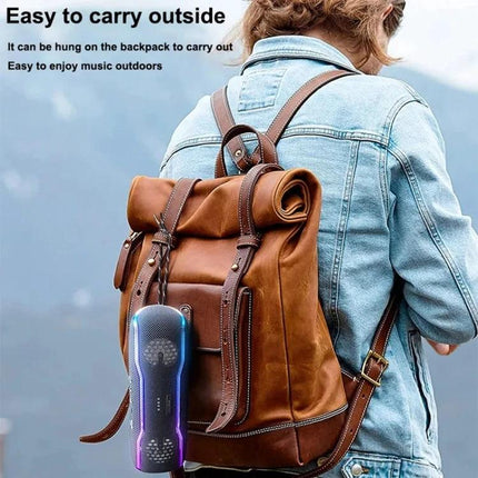 XDOBO Portable Bluetooth Speaker For Outdoor Picnics clipped to backpack with lanyard, IPX7 splash resistant LED lights