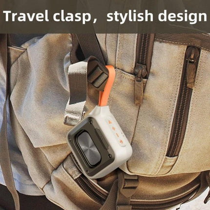 XDOBO Compact Bluetooth Speaker With Silicone Lanyard clipped to backpack, IPX7 weather-resistant portable outdoor speaker