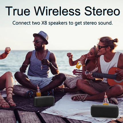XDOBO Portable Bluetooth Speaker For Outdoor And Home Use playing at a beach picnic with friends enjoying music and drinks
