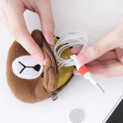 A Compact Organizer for Daily Earphone Cable Protection holding coiled earphones neatly in a small zip pouch to prevent tangles and damage
