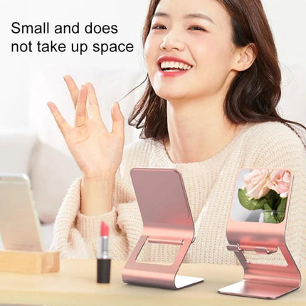 Metal Desktop Stand for Phones, Tablets and Makeup Mirror holding phone and mirror on desk with smiling woman, compact stable bracket for video calls and makeup