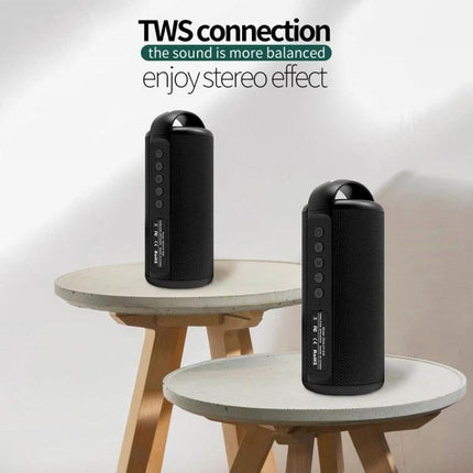 Zealot Compact Bluetooth Speaker With Carry Handle For Travel shown in TWS stereo setup on two small round tables