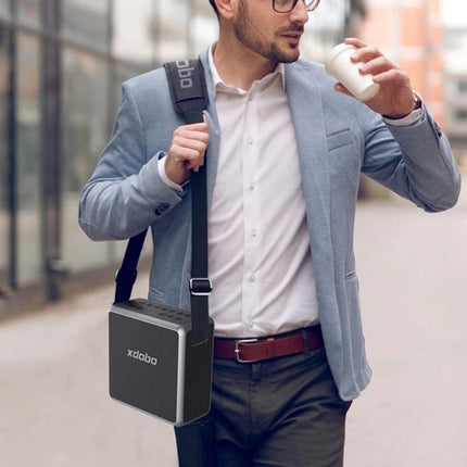 XDOBO Portable Bluetooth Speaker For Home And Picnics shown worn with shoulder strap at urban picnic or commute, 140W four-speaker sound
