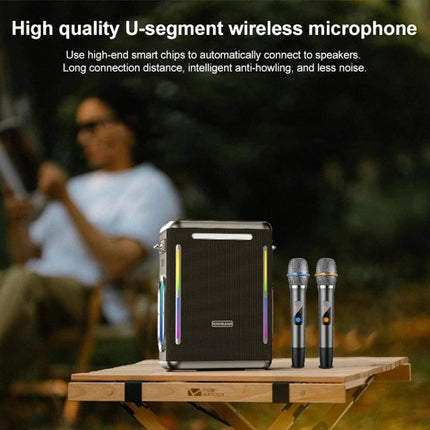 SINOBAND Portable Outdoor Speaker With Mood Light For Picnics on picnic table with two wireless microphones and mood lighting