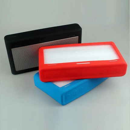 Compact Silicone Carry Case For Bose Portable Speaker shown in red blue and black silicone protective covers