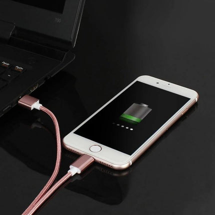 A Magnetic Cable for Daily Device Charging and Syncing showing a phone charging via a rose gold magnetic cable connected to a laptop