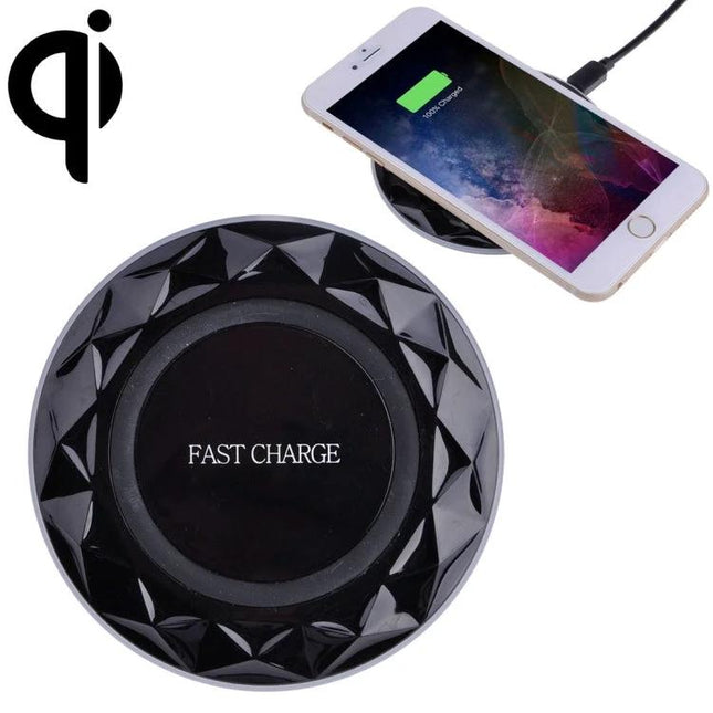 Essential wireless charging pad for everyday smartphone use at home - black fast charge pad with phone on desk