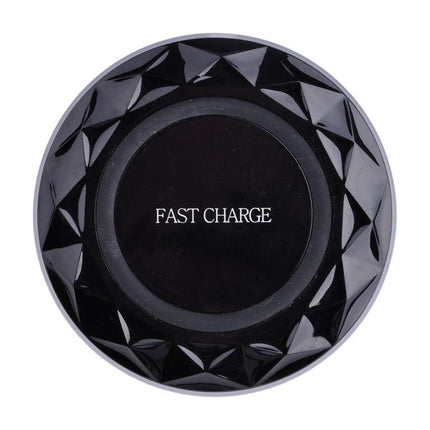 Essential wireless charging pad for everyday smartphone use at home - black fast charge pad on desk