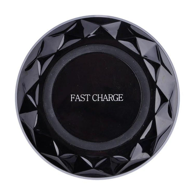 Essential wireless charging pad for everyday smartphone use at home - black fast charge pad on desk