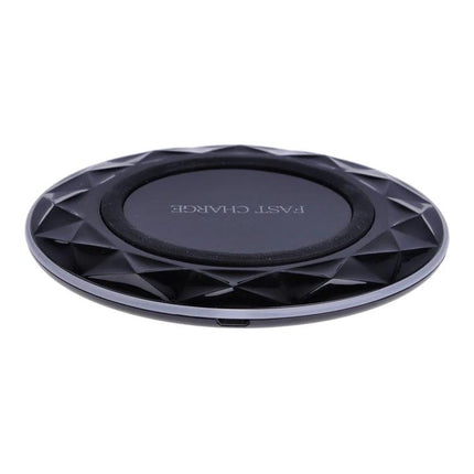 Essential wireless charging pad for everyday smartphone use at home - black fast-charge wireless charging pad on desk