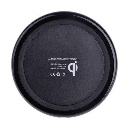 Essential wireless charging pad for everyday smartphone use at home - black round Qi fast wireless charger on white background