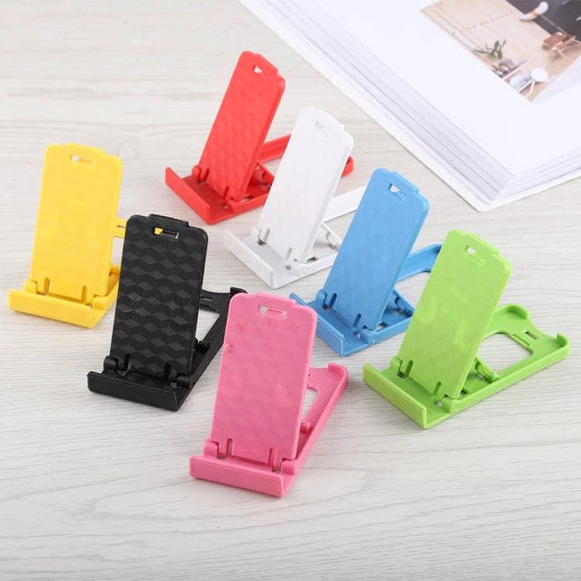 Portable Adjustable Stand for Smartphones and Tablets in multiple colors displayed on a desk for viewing, typing, and video calls