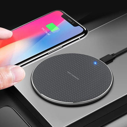 Essential K8 Wireless Charger for Daily Office Use charging smartphone on a tidy office desk, compact round wireless pad