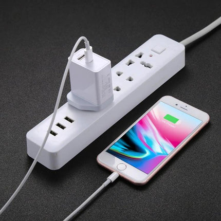 Cable for Charging Phones During Daily Commutes and Home Use connected to phone on power strip, lightweight cable for travel and bedside charging