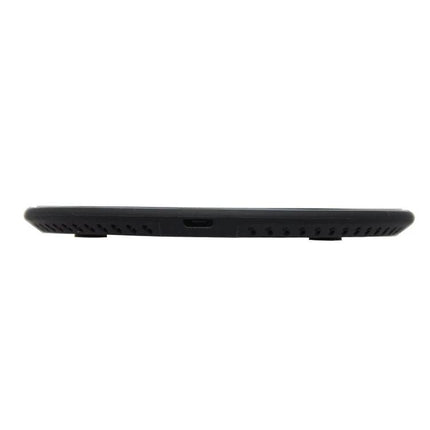 Compact Wireless Charger for Daily Phone Use at Home on a desk, low-profile black KD-1 showing side USB port and ventilation