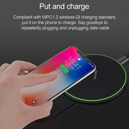 Compact Wireless Charger for Daily Phone Use at Home on desk showing phone charging with fingertip and clutter-free nightstand