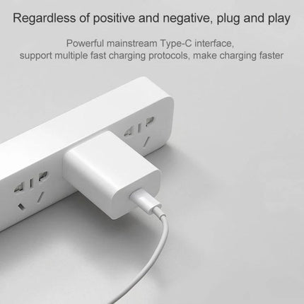 Xiaomi Travel Charger for Everyday Trips and Daily Use plugged into power strip with USB-C cable, compact 20W travel charger for phones and tablets