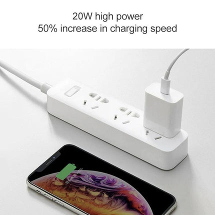 Xiaomi Travel Charger for Everyday Trips and Daily Use plugged into power strip charging phone with 20W fast charge