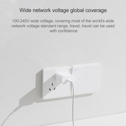 Xiaomi Travel Charger for Everyday Trips and Daily Use plugged into wall outlet showing wide 100-240V voltage coverage and charging cable