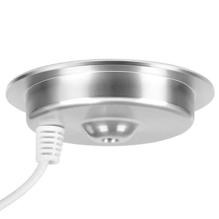 Embedded Wireless Charger for Desk Use in Daily Settings - silver flush-mount wireless charging puck installed in desk, cable attached