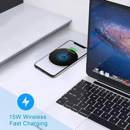 Embedded Wireless Charger for Desk Use in Daily Settings showing a phone charging wirelessly beside a laptop on a clean desk