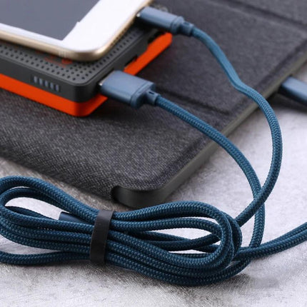 REMAX Charging Cable for Everyday Device Use at Home and Travel — durable braided charging cable connected to phone and power bank, packed for home and travel