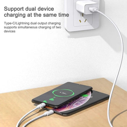 Awei Multi Cable for Everyday Device Charging On the Go connected to wall charger charging two phones simultaneously on a desk