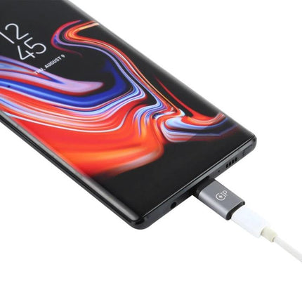 USB-C to Lightning Adapter for Everyday Device Charging connected to smartphone for charging and data transfer on the go