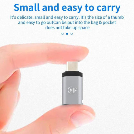 USB-C to Lightning Adapter for Everyday Device Charging small thumb-size adapter held between fingers for travel charging