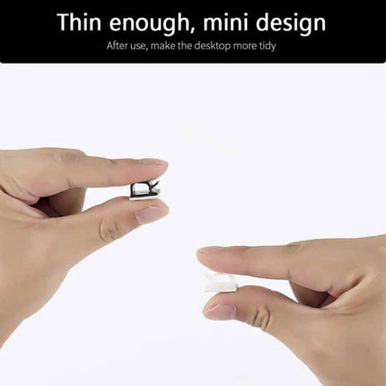 Cable Clips for Organizing Desk Cables in Daily Use - thin mini plastic clips held between fingers to keep cords tidy