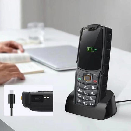 Keep your AGM device charged and handy on your desk. Black AGM phone on charging dock angled for reading and video calls