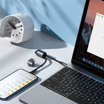 REMAX Lanyard USB-C Cable for Everyday Travel Essentials shown charging a laptop and smartphone on a desk, compact lanyard design attached to keys