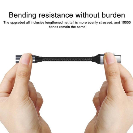 Adapter for Connecting USB-C Devices to 3.5mm Headphones Daily showing hands stretching a braided USB-C to 3.5mm adapter demonstrating bending resistance