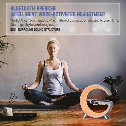 Compact Home Speaker With Wireless Charging And Ambient Light on nightstand playing soft audio and sunrise lighting