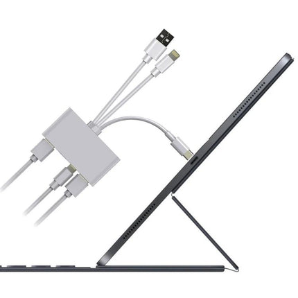 Adapter for Easy Photo Transfer from Camera to iPhone on the Go shown connected to an iPad/tablet with multiple cable ports