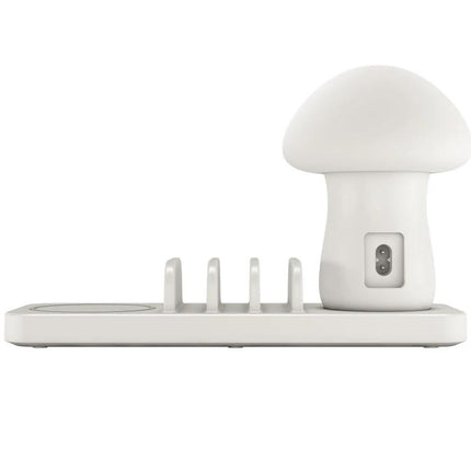 Versatile Charging Station for Daily Home Device Needs white multi-device charger with wireless pad, three USB outputs, and mushroom-shaped nightstand lamp
